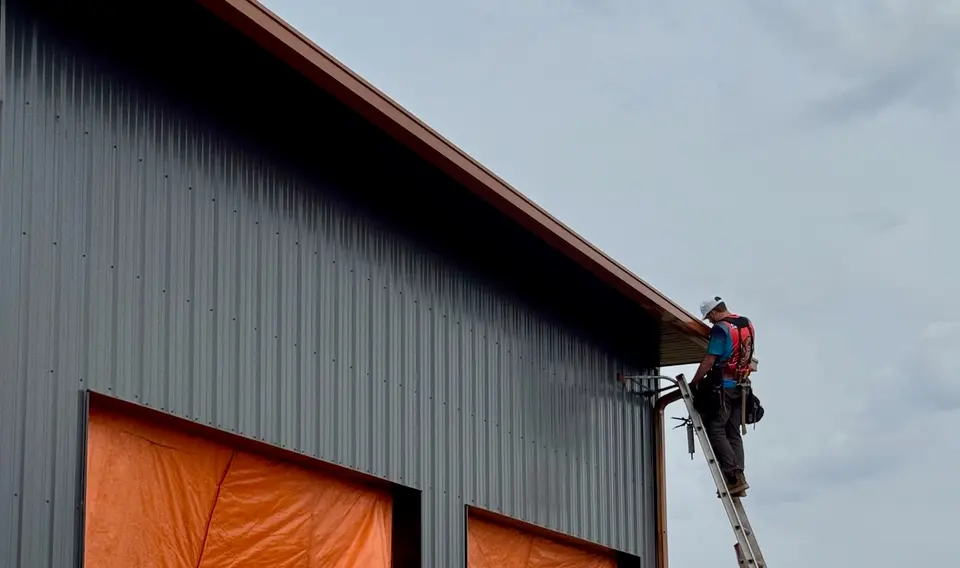 Box-style copper gutter being installed