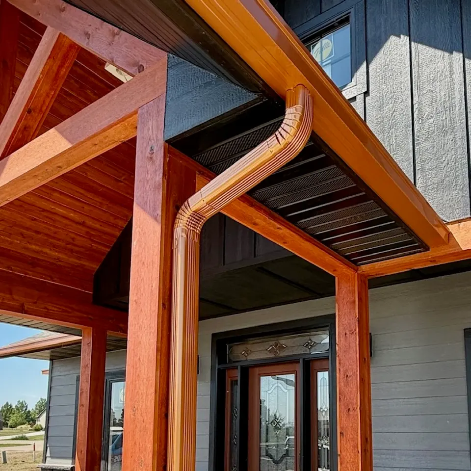 Copper downspout on an exterior wall
