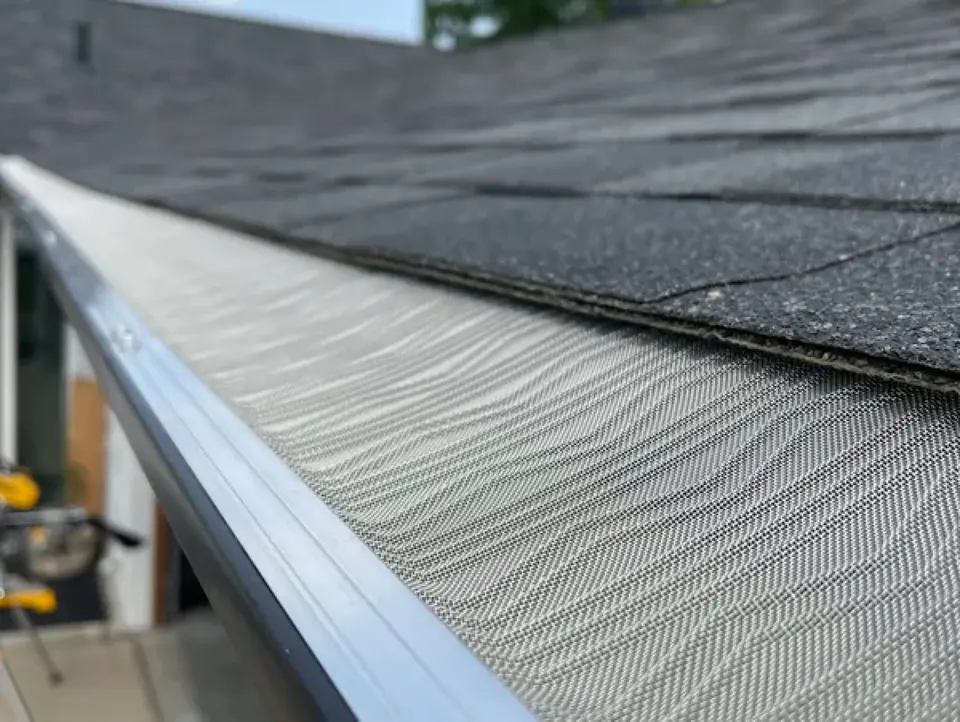 Close-up of micro-mesh gutter guard installed in a gutter