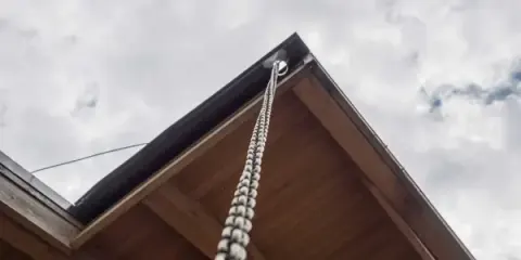 Rain chain installed as a downspout alternative