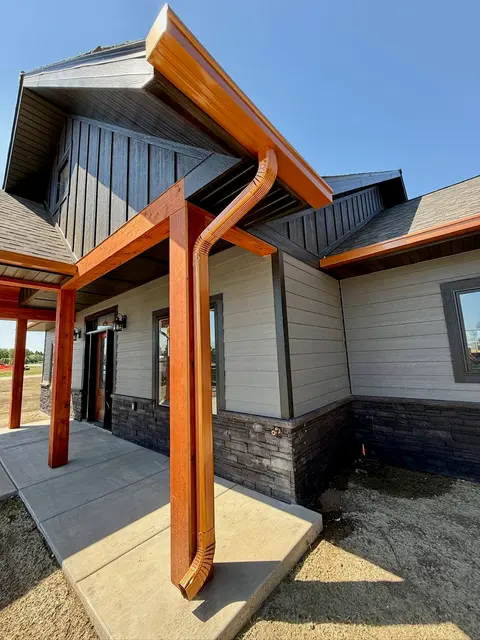 Copper gutter installed on a timber post home